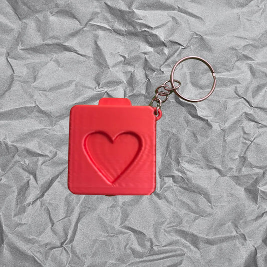 Regala este llavero guarda foto personalizable con forma de cámara instantánea