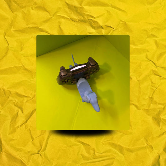 Soporte para mando de videoconsola con forma de perro salchicha impreso en 3D